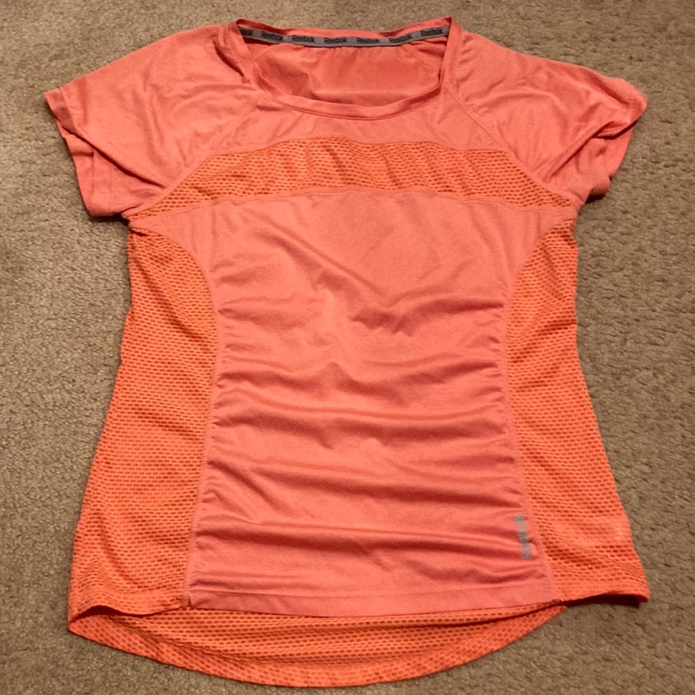Womens athletic orange reflective breathable workout top by Reebok- Medium.